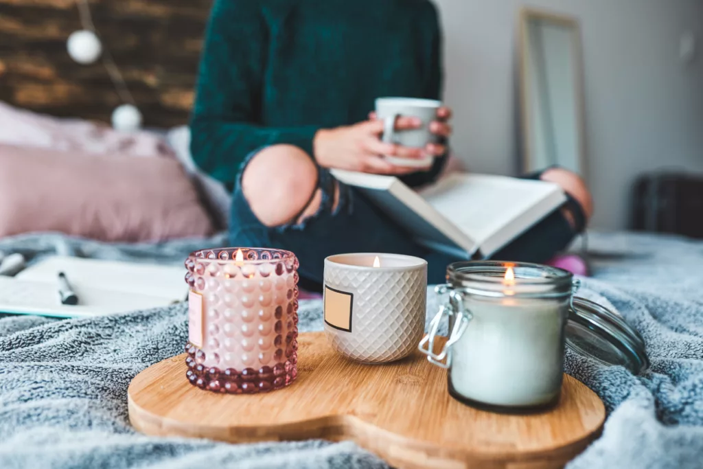 Cropped shot of an unrecognizable young woman relaxing next to her high-end scented candles