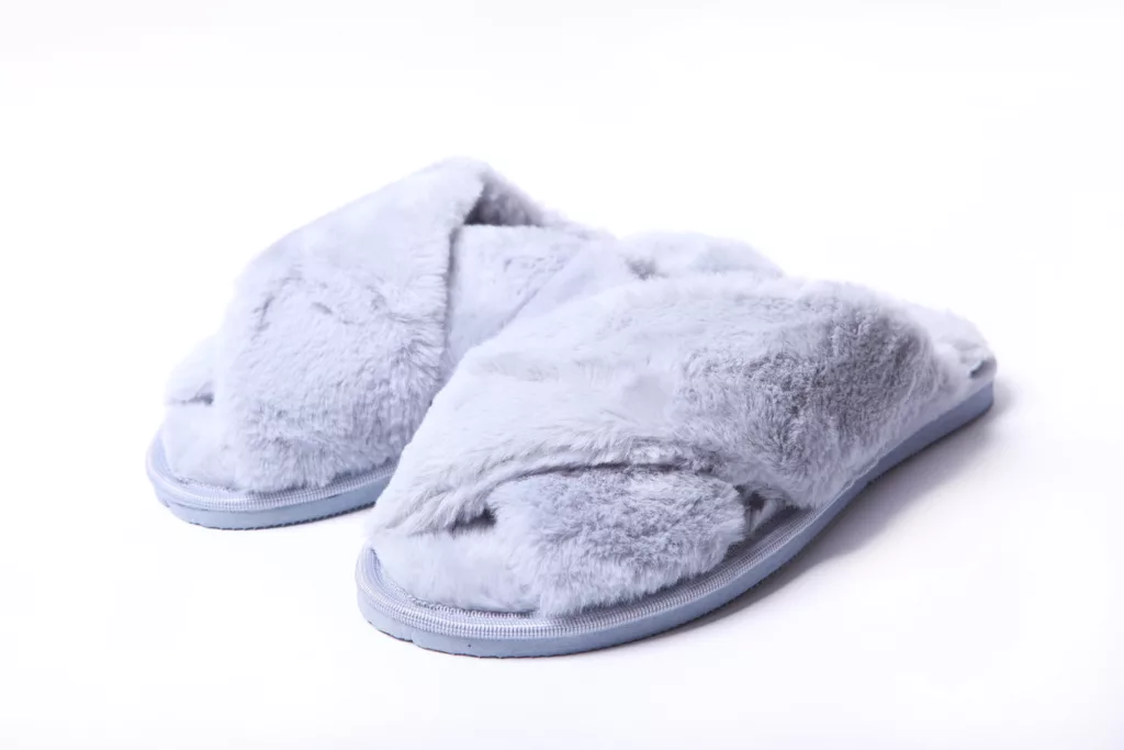 Lavender memory foam slippers on a white background