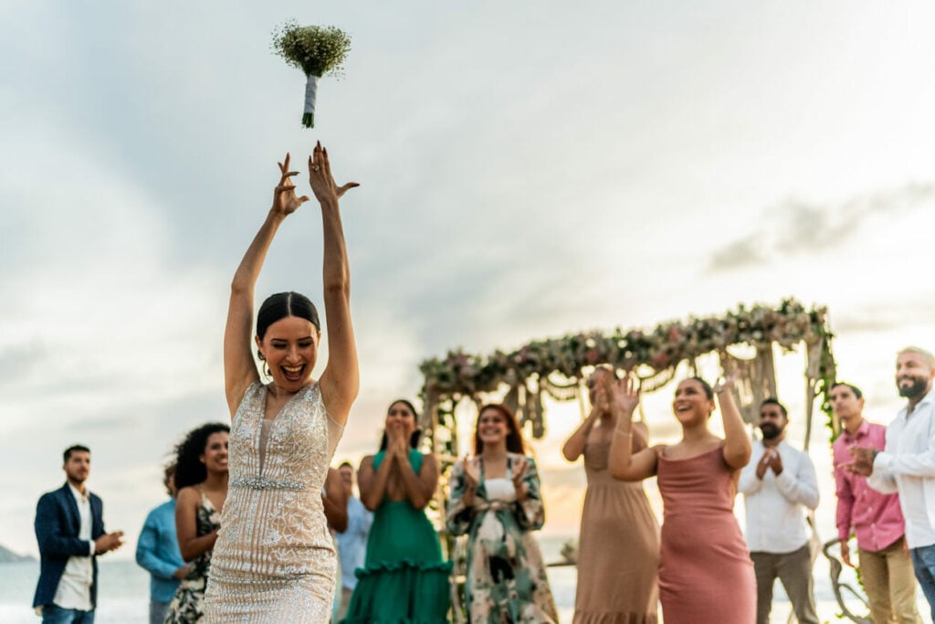 A bride throws the bouquet